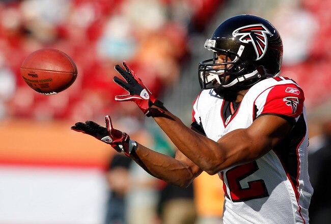 TAMPA, FL - DECEMBER 05:  Receiver Michael Jenkins #12 of the Atlanta Falcons catches a pass during warmups against the Tampa Bay Buccaneers at Raymond James Stadium on December 5, 2010 in Tampa, Florida.  (Photo by J. Meric/Getty Images)
