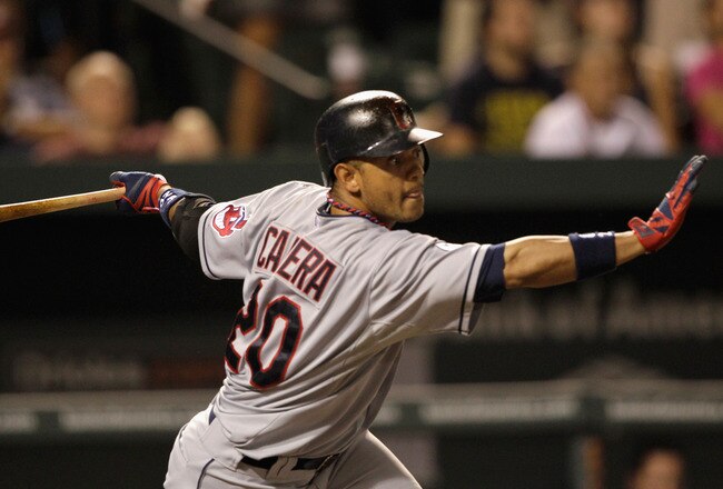 BALTIMORE, MD - JULY 16:  Orlando Cabrera #20 of the Cleveland Indians follows his three RBI double against the Baltimore Orioles during the ninth inning at Oriole Park at Camden Yards on July 16, 2011 in Baltimore, Maryland. The Orioles defeated the Indians 6-5.  (Photo by Rob Carr/Getty Images)