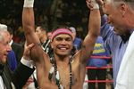 LAS VEGAS - JULY 15:  Daniel Ponce De Leon raises his arms after knocking out Sod Looknongyangtoy 52 seconds into the first round of their WBO junior featherweight world championship fight at the MGM Grand Garden Arena July 15, 2006 in Las Vegas, Nevada.  (Photo by Jed Jacobsohn/Getty Images)