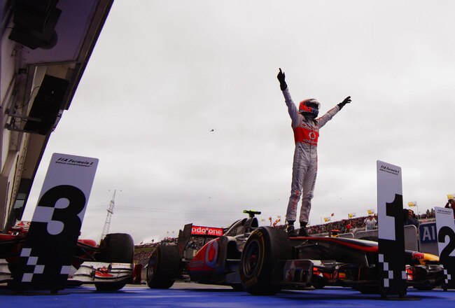 BUDAPEST, HUNGARY - JULY 31:  Jenson Button of Great Britain and McLaren celebrates in parc ferme after winning his 200th Grand Prix during the Hungarian Formula One Grand Prix at the Hungaroring on July 31, 2011 in Budapest, Hungary.  (Photo by Vladimir Rys/Getty Images)