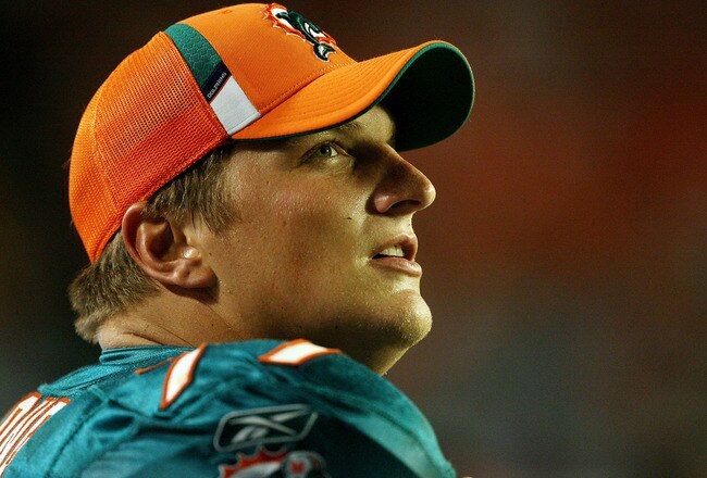 MIAMI - AUGUST 22:  Offensive tackle Jake Long #77 of the Miami Dolphins watches from the sidelines as his team takes on the Carolina Panthers during a pre-season game at Land Shark Stadium on August 22, 2009 in Miami, Florida. The Dolphins defeated the Panthers 27-17.  (Photo by Doug Benc/Getty Images)