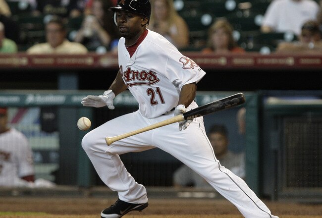 HOUSTON, TX - JULY 20: Michael Bourn #21 of the Houston Astros lays down a bunt single in the 5th inning against the Washington Nationals on July 20, 2011 at Minute Maid Park in Houston, Texas. Astros won in the bottom of the 11th 3 - 2. (Photo by Thomas B. Shea/Getty Images)