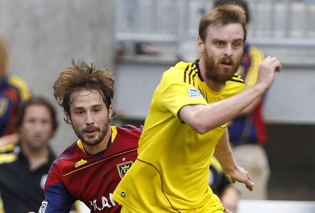 SANDY, UT - JULY 30: Ned Grabavoy #20 of Real Salt Lake has the ball taken from him by Eddie Gaven #12 of Columbus Crew during the first half of an MLS soccer game July 30, 2011 at Rio Tinto Stadium in Sandy, Utah. (Photo by George Frey/Getty Images)