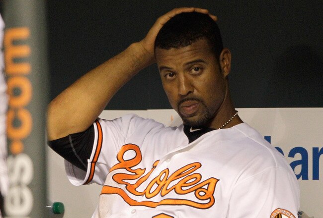 BALTIMORE, MD - JULY 18: Derrek Lee #25 of the Baltimore Orioles sits in the dugout during the Orioles game against the Boston Red Sox at Oriole Park at Camden Yards on July 18, 2011 in Baltimore, Maryland. (Photo by Rob Carr/Getty Images)