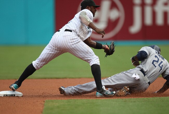 MIAMI GARDENS, FL - JULY 21:  Cameron Maybin #24 of the San Diego Padres slides into second base under the tag of Hanley Ramirez #2 of the Florida Marlins during a game at Sun Life Stadium on July 21, 2011 in Miami Gardens, Florida.  (Photo by Sarah Glenn/Getty Images)