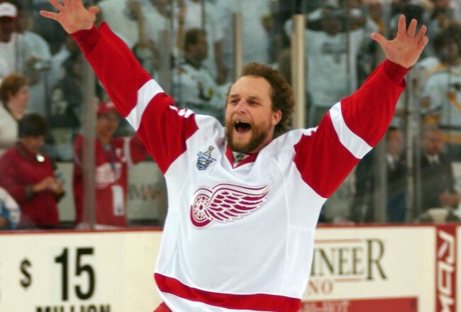 PITTSBURGH - JUNE 04:  Darren McCarty #25 of the Detroit Red Wings celebrates after defeating the Pittsburgh Penguins in game six of the 2008 NHL Stanley Cup Finals at Mellon Arena on June 4, 2008 in Pittsburgh. Pennsylvania. The Red Wings defeated the Penguins 3-2 to win the Stanley Cup Finals 4 games to 2.  (Photo by A. J. Messier/Getty Images)