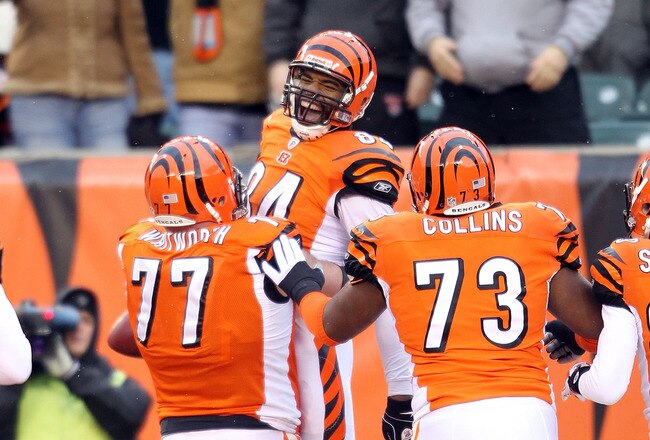 CINCINNATI - DECEMBER 26: Jermaine Gresham #84 of the Cincinnati Bengals celebrates with Andrew Whitworth #77 and Anthony Collins #73 after scoring a touchdown during the NFL game against the San Diego Chargers at Paul Brown Stadium on December 26, 2010 in Cincinnati, Ohio. The Bengals 34-20.  (Photo by Andy Lyons/Getty Images)