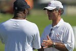 BOURBONNAIS, IL - JULY 30:  General manager Jerry Angelo of the Chicago Bears (R) talks with head coach Lovie Smith during a summer training camp practice at Olivet Nazarene University on July 30, 2011 in Bourbonnais, Illinois.  (Photo by Jonathan Daniel/Getty Images)