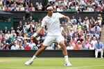 LONDON, ENGLAND - JUNE 29:  Roger Federer of Switzerland returns a shot during his quarterfinal round match against Jo-Wilfried Tsonga of France on Day Nine of the Wimbledon Lawn Tennis Championships at the All England Lawn Tennis and Croquet Club on June 29, 2011 in London, England.  (Photo by Julian Finney/Getty Images)