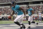 ARLINGTON, TX - OCTOBER 31:  Wide receiver Mike Sims-Walker #11 of the Jacksonville Jaguars celebrates a touchdown against the Dallas Cowboys in the first quarter at Cowboys Stadium on October 31, 2010 in Arlington, Texas.  (Photo by Ronald Martinez/Getty Images)