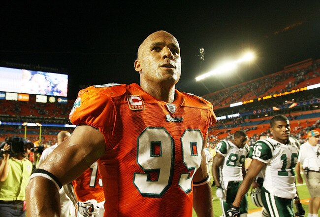 MIAMI - OCTOBER 12:  Linebacker Jason Taylor #99 of the Miami Dolphins celebrates after defeating the New York Jets at Land Shark Stadium on October 12, 2009 in Miami, Florida. The Dolphins defeated the Jets 31-27.  (Photo by Doug Benc/Getty Images)