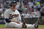 MINNEAPOLIS, MN - APRIL 24: Justin Morneau #33 of the Minnesota Twins reacts after being tagged out at home plate for the final out of the third inning against the Cleveland Indians during their game on April 24, 2011 at Target Field in Minneapolis, Minnesota. Twins defeated the Indians 4-3. (Photo by Hannah Foslien/Getty Images)