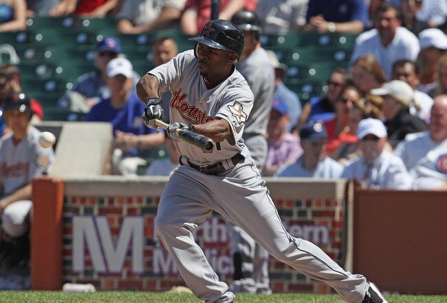 CHICAGO, IL - JUNE 01:  Michael Bourn #21 of the Houston Astros bunts the ball against the Chicago Cubs at Wrigley Field on June 1, 2011 in Chicago, Illinois. The Astros defeated the Cubs 3-1.  (Photo by Jonathan Daniel/Getty Images)