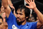 LAS VEGAS, NV - MAY 07:  Boxer Manny Pacquiao reacts at the end of his WBO welterweight title fight against Shane Mosley at the MGM Grand Garden Arena May 7, 2011 in Las Vegas, Nevada. Pacquiao retained his title by unanimous decision.  (Photo by Ethan Miller/Getty Images)