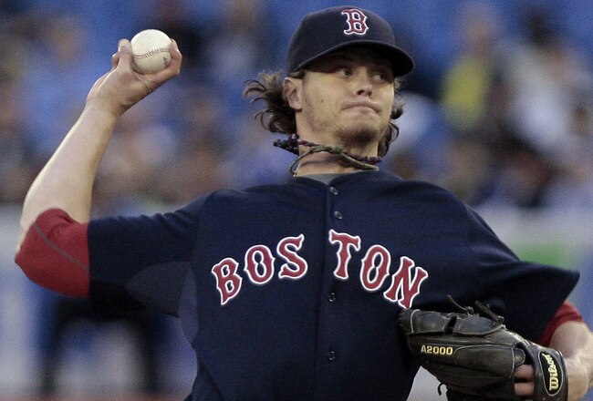TORONTO, CANADA - JUNE 10:  Clay Buchholz #11 of the Boston Red Sox throws a pitch during MLB action against the Toronto Blue Jays at The Rogers Centre June 10, 2011 in Toronto, Ontario, Canada. (Photo by Abelimages/Getty Images)