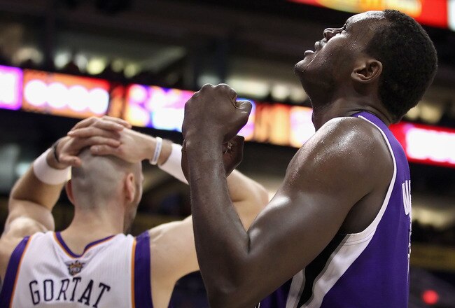PHOENIX, AZ - FEBRUARY 13:  Samuel Dalembert #10 of the Sacramento Kings celebrates after the Kings scored against Marcin Gortat #4 and the Phoenix Suns during the NBA game at US Airways Center on February 13, 2011 in Phoenix, Arizona.  The Kings defeated the Suns 113-108. NOTE TO USER: User expressly acknowledges and agrees that, by downloading and or using this photograph, User is consenting to the terms and conditions of the Getty Images License Agreement.  (Photo by Christian Petersen/Getty Images)
