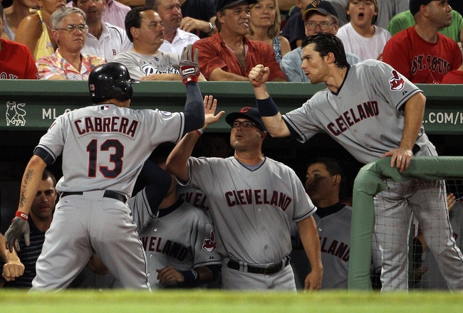 BOSTON, MA - AUGUST 01:  Asdrubal Cabrera #13 of the Cleveland Indians is congratulated by teammates in the dugout after his two run homer in the sixth inning against the Boston Red Sox on August 1, 2011 at Fenway Park in Boston, Massachusetts.  (Photo by Elsa/Getty Images)