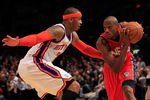 NEW YORK, NY - MARCH 30: Travis Outlaw #21 of the New Jersey Nets drives against Carmelo Anthony #7 of the New York Knicks at Madison Square Garden on March 30, 2011 in New York City. NOTE TO USER: User expressly acknowledges and agrees that, by downloading and/or using this Photograph, User is consenting to the terms and conditions of the Getty Images License Agreement. The Knicks defeated the Nets 120-116.  (Photo by Chris Trotman/Getty Images)