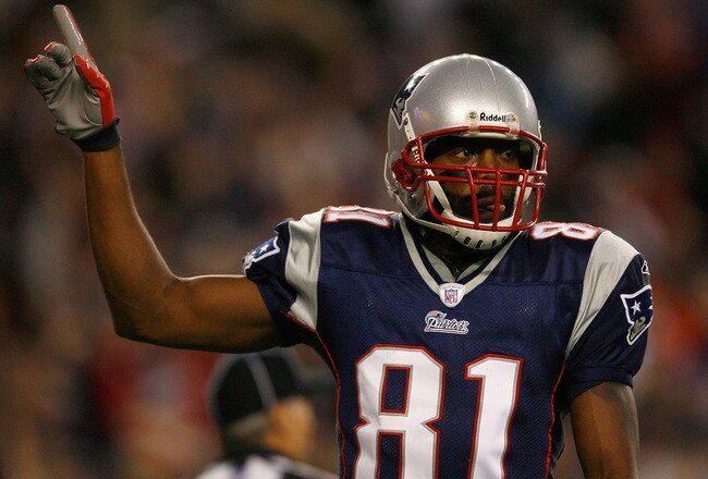 FOXBORO, MA - DECEMBER 23:  Randy Moss # 81 of the New England Patriots  scores a touchdown in the first quarter against the Miami Dolphins at Gillette Stadium on December 23, 2007 in Foxboro, Massachusetts. (Photo by Jim Rogash/Getty Images)