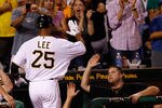 PITTSBURGH - AUGUST 01:  Derrek Lee #25 of the Pittsburgh Pirates is congratulated by teammate Chris Snyder #19 after he hit a two run home run in the 8th inning against the Chicago Cubs during the game on August 1, 2011 at PNC Park in Pittsburgh, Pennsylvania.  (Photo by Jared Wickerham/Getty Images)