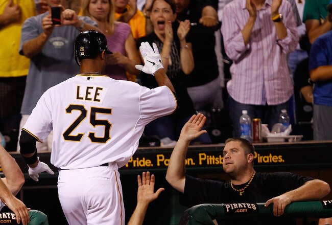 PITTSBURGH - AUGUST 01:  Derrek Lee #25 of the Pittsburgh Pirates is congratulated by teammate Chris Snyder #19 after he hit a two run home run in the 8th inning against the Chicago Cubs during the game on August 1, 2011 at PNC Park in Pittsburgh, Pennsylvania.  (Photo by Jared Wickerham/Getty Images)