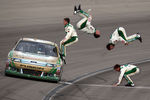 LAS VEGAS, NV - MARCH 06:  (***EDITOR'S NOTE*** COMPOSITE PHOTO ILLUSTRATION CREATED USING MULTIPLE IMAGES) Carl Edwards, driver of the #99 Scotts/Kellogg's Ford, celebrates with a flip from his car after winning the NASCAR Sprint Cup Series Kobalt Tools 400 at Las Vegas Motor Speedway on March 6, 2011 in Las Vegas, Nevada.  (Photo by Jonathan Ferrey/Getty Images)