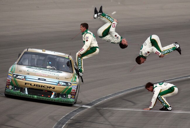 LAS VEGAS, NV - MARCH 06:  (***EDITOR'S NOTE*** COMPOSITE PHOTO ILLUSTRATION CREATED USING MULTIPLE IMAGES) Carl Edwards, driver of the #99 Scotts/Kellogg's Ford, celebrates with a flip from his car after winning the NASCAR Sprint Cup Series Kobalt Tools 400 at Las Vegas Motor Speedway on March 6, 2011 in Las Vegas, Nevada.  (Photo by Jonathan Ferrey/Getty Images)