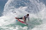 HUNTINGTON BEACH, CA - JULY 26:  Dillon Perillo (USA) slides his tail as he turns off the top during Junior Men's Final of the 2009 Hurley U.S. Open of Surfing on July 26, 2009 in Huntington Beach, California.  (Photo by Victor Decolongon/Getty Images)