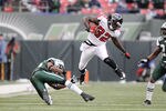 EAST RUTHERFORD, NJ - DECEMBER 20: Jerious Norwood #32 of the Atlanta Falcons carries the ball during an NFL game against the New York Jets at Giants Stadium on December 20, 2009 in East Rutherford, New Jersey. (Photo by Jim Luzzi/Getty Images)
