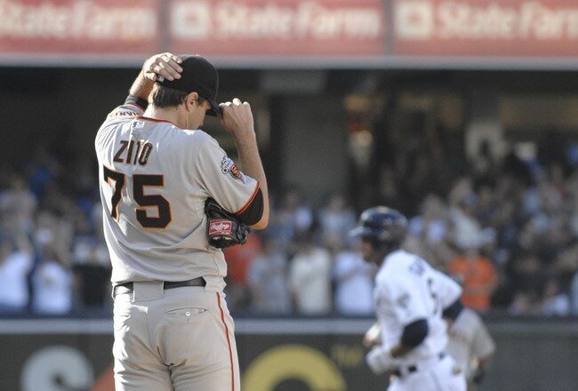 SAN DIEGO, CA - JULY 16: Barry Zito #75 of the San Francisco Giants steps off the mound as Jesus Guzman #15 of the San Diego Padres rounds the bases after hitting a three-run homer during the first inning of a baseball game at Petco Park on July 16, 2011 in San Diego, California. (Photo by Denis Poroy/Getty Images)
