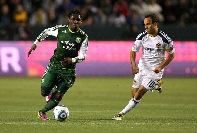 CARSON, CA - APRIL 23:  Kalif Alhassan #11 of the Portland Timbers paces the ball on the attack against Landon Donovan #10 of the Los Angeles Galaxy during the MLS match at The Home Depot Center on April 23, 2011 in Carson, California. The Galaxy defeated the Timbers 3-0.  (Photo by Victor Decolongon/Getty Images)