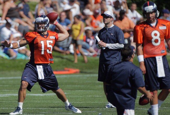 ENGLEWOOD, CO - JULY 28:  (L-R) Tim Tebow #15 and quarterback Kyle Orton #8 of the Denver Broncos take part in training camp at the Paul D. Bowlen Memorial Broncos Centre at Dove Valley on July 28, 2011 in Englewood, Colorado.  (Photo by Doug Pensinger/Getty Images)