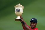AKRON, OH - AUGUST 27:  Tiger Woods holds the Gary Player Cup after winning the Bridgestone Invitational at Firestone Country Club August 27, 2006 in Akron, Ohio.  (Photo by Montana Pritchard/Getty Images)