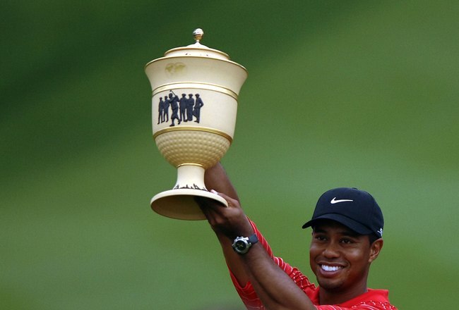 AKRON, OH - AUGUST 27:  Tiger Woods holds the Gary Player Cup after winning the Bridgestone Invitational at Firestone Country Club August 27, 2006 in Akron, Ohio.  (Photo by Montana Pritchard/Getty Images)