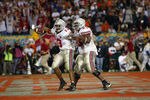 TEMPE, AZ - JANUARY 3:  Running back Maurice Clarett #13 of the Ohio State Buckeyes scores the team's game winning touchdown in double-overtime against the University of Miami Hurricanes during the Tostitos Fiesta Bowl at Sun Devil Stadium on January 3, 2003 in Tempe, Arizona.  Ohio State won the game 31-24, winning the NCAA National Championship.  (Photo by Jamie Squire/Getty Images)