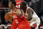 CHICAGO, IL - DECEMBER 21: Evan Turner #12 of the Philadelphia 76ers moves past Ronnie Brewer #11 of the Chicago Bulls at the United Center on December 21, 2010 in Chicago, Illinois. The Bulls defeated the 76ers 121-76. NOTE TO USER: User expressly acknowledges and agrees that, by downloading and/or using this photograph, User is consenting to the terms and conditions of the Getty Images License Agreement. (Photo by Jonathan Daniel/Getty Images)