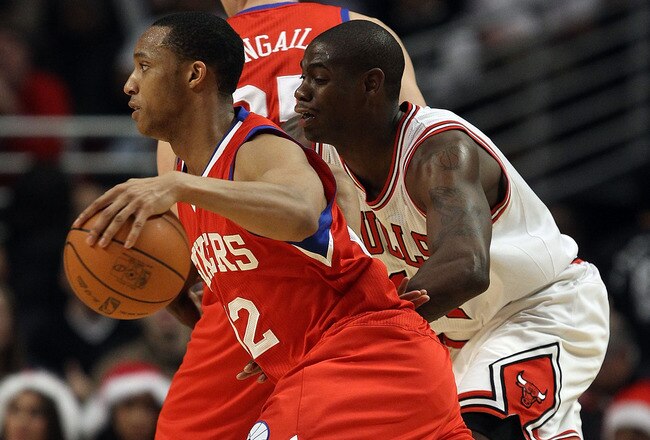 CHICAGO, IL - DECEMBER 21: Evan Turner #12 of the Philadelphia 76ers moves past Ronnie Brewer #11 of the Chicago Bulls at the United Center on December 21, 2010 in Chicago, Illinois. The Bulls defeated the 76ers 121-76. NOTE TO USER: User expressly acknowledges and agrees that, by downloading and/or using this photograph, User is consenting to the terms and conditions of the Getty Images License Agreement. (Photo by Jonathan Daniel/Getty Images)