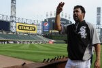 CHICAGO, IL - AUGUST 01: Ozzie Guillen #13 manager of the Chicago White Sox looks at an 8-foot steel I-beam from the World Trade Center wreckage on display during the Chicago White Sox and New York Yankees game on August 1, 2011 at U.S. Cellular Field in Chicago, Illinois. The beam will have permanent home in Darien, Illinois.  (Photo by David Banks/Getty Images)