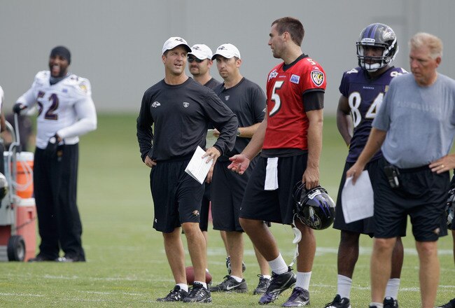 OWINGS MILLS, MD - JULY 29:  Head coach John Harbaugh talks with quarterback Joe Flacco #5 of the Baltimore Ravens works out during training camp on July 29, 2011 in Owings Mills, Maryland.  (Photo by Rob Carr/Getty Images)