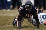 CHICAGO, IL - JANUARY 16:  Tommie Harris #91 of the Chicago Bears reacts after a sack of quarterback Matt Hasselbeck #8 of the Seattle Seahawks in the 2011 NFC divisional playoff game at Soldier Field on January 16, 2011 in Chicago, Illinois.  (Photo by Jonathan Daniel/Getty Images)