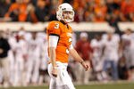 STILLWATER, OK - NOVEMBER 27:  Quarterback Brandon Weeden #3 of the Oklahoma State Cowboys walks off the field after failing to make a first down against the Oklahoma Sooners at Boone Pickens Stadium on November 27, 2010 in Stillwater, Oklahoma.  (Photo by Tom Pennington/Getty Images)