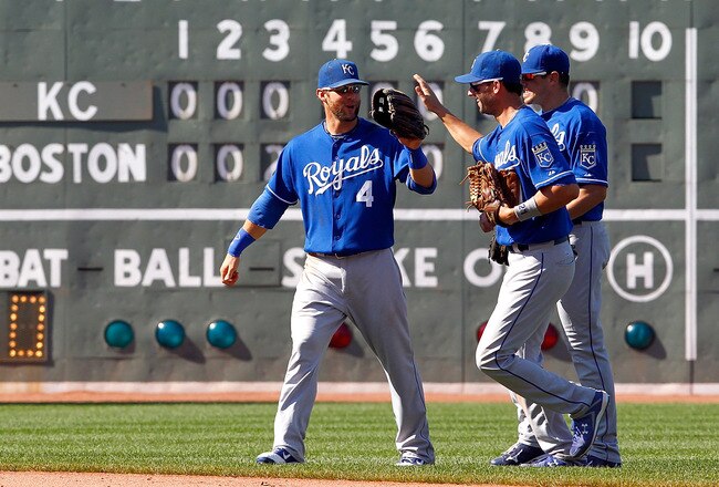 BOSTON, MA  - JULY 28:  Alex Gordon #4, Mitch Maier #12 and Jeff Francoeur #21 of the Kansas City Royals celebrate their 4-3 win over the Boston Red Sox at Fenway Park on July 28, 2011 in Boston, Massachusetts.  (Photo by Jim Rogash/Getty Images)