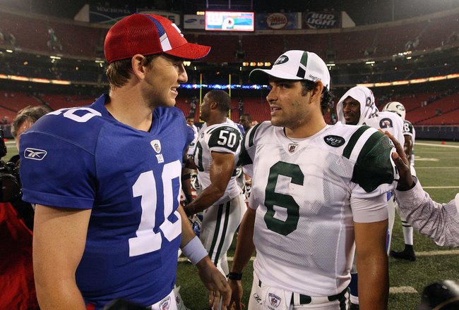 EAST RUTHERFORD, NJ - AUGUST 29:  Eli Manning #10 of the New York Giants talks with Mark Sanchez #6 of the New York Jets after their game on August 29, 2009 at Giants Stadium in East Rutherford, New Jersey.  (Photo by Jim McIsaac/Getty Images)