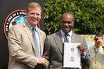 CANTON, OH - AUGUST 05: Commissioner of the National Football League, Roger Goodell and Director of the National Football League Players' Association, DeMaurice Smith pose with the new Collective Bargaining Agreement on the front steps of the Pro Football Hall of Fame on August 5, 2011 in Canton, Ohio.  (Photo by Michael Loccisano/Getty Images for Bud Lite)