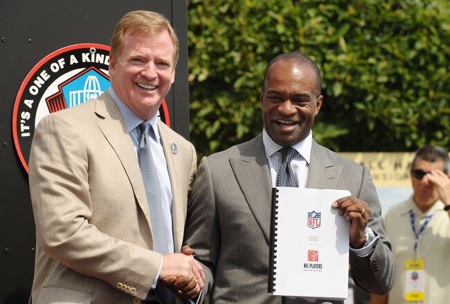 CANTON, OH - AUGUST 05: Commissioner of the National Football League, Roger Goodell and Director of the National Football League Players' Association, DeMaurice Smith pose with the new Collective Bargaining Agreement on the front steps of the Pro Football Hall of Fame on August 5, 2011 in Canton, Ohio.  (Photo by Michael Loccisano/Getty Images for Bud Lite)