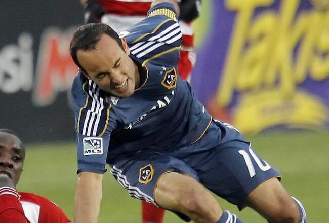 FRISCO, TX - MAY 1: Jair Benitez #5 of FC Dallas and Landon Donovan #10 of the Los Angeles Galaxy  battle for control of the ball during the first half of a soccer game at Pizza Hut Park on May 1, 2011 in Frisco, Texas. FC Dallas won 2-1.  (Photo by Brandon Wade/Getty Images)