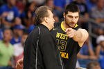 TAMPA, FL - MARCH 19:  (L-R) Head coach Bob Huggins of the West Virginia talks with Deniz Kilicli #13 against the Kentucky Wildcats during the third round of the 2011 NCAA men's basketball tournament at St. Pete Times Forum on March 19, 2011 in Tampa, Florida. Kentucky won 71-63. (Photo by J. Meric/Getty Images)