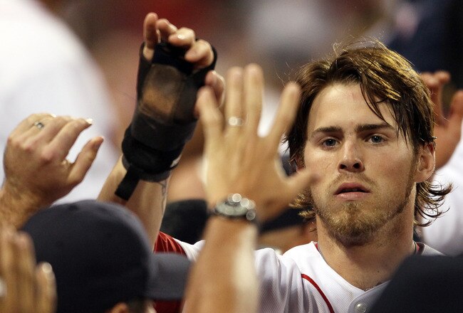 BOSTON, MA - JULY 26:  Josh Reddick #16 of the Boston Red Sox is congratulated after he scored in the fifth inning against the Kansas City Royals on July 26, 2011 at Fenway Park in Boston, Massachusetts.  (Photo by Elsa/Getty Images)