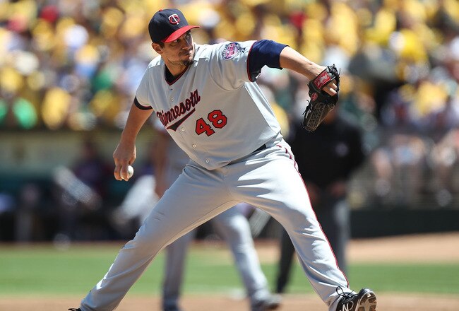 OAKLAND, CA - JULY 31:  Carl Pavano #48 of the Minnesota Twins pitches against the Oakland Athletics at Oakland-Alameda County Coliseum on July 31, 2011 in Oakland, California.  (Photo by Jed Jacobsohn/Getty Images)