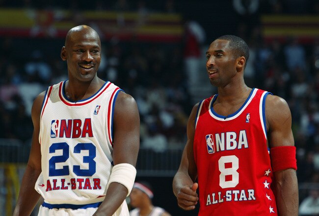 ATLANTA - FEBRUARY 9:  Michael Jordan (Washington Wizards) #23 of the Eastern Conference All-Stars talks with Kobe Bryant (Los Angeles Lakers) #8 of the Western Conference All-Stars at the 2003 NBA All-Star Game on February 9, 2003 at Philips Arena in Atlanta, Georgia.  NOTE TO USER:  User expressly acknowledges and agrees that, by downloading and or using this photograph, user is consenting to the terms and conditions of the Getty Images license agreement. (Photo by Jamie Squire/Getty Images)